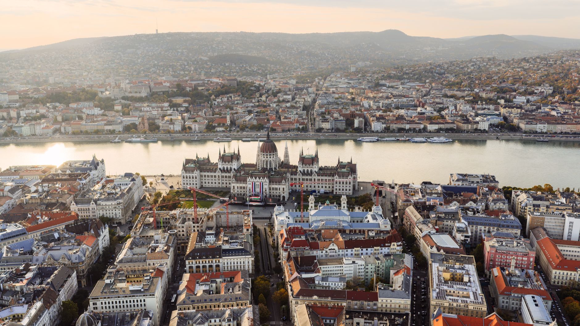 Aerial view of the spectacular Hungarian Parliament building along the Danube River at sunset